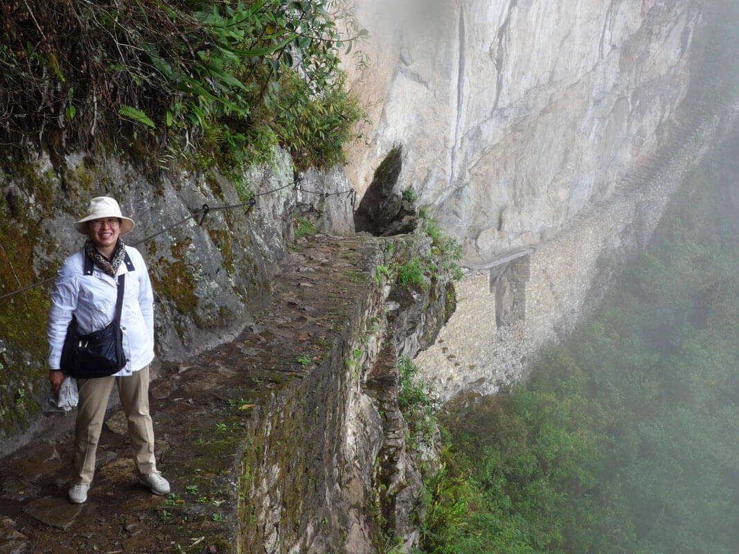 Our video host, on the path to her Big Vision and the Inca Bridge in Machu Picchu, Peru.